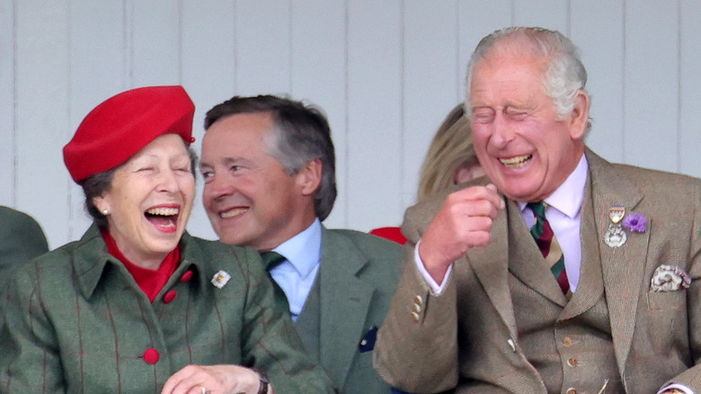 Princess Anne laughing with King Charles