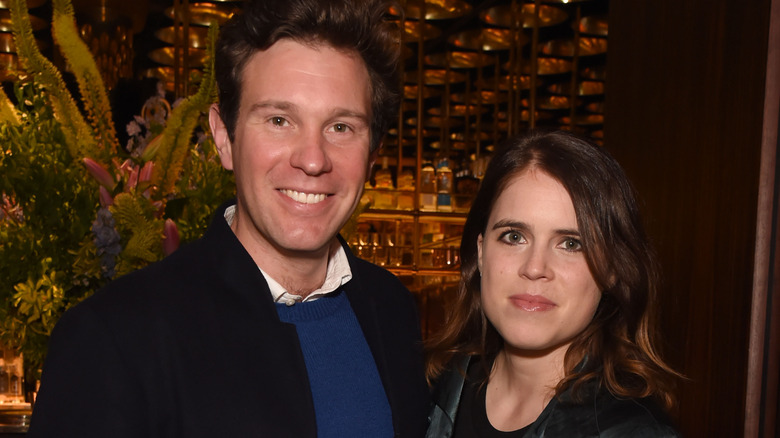 Princess Eugenie and husband Jack Brooksbank posing at event