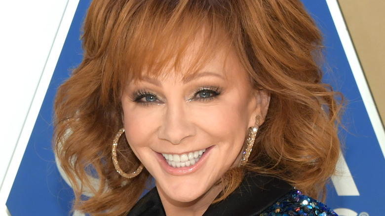 Reba McEntire wears sparkly hoop earrings