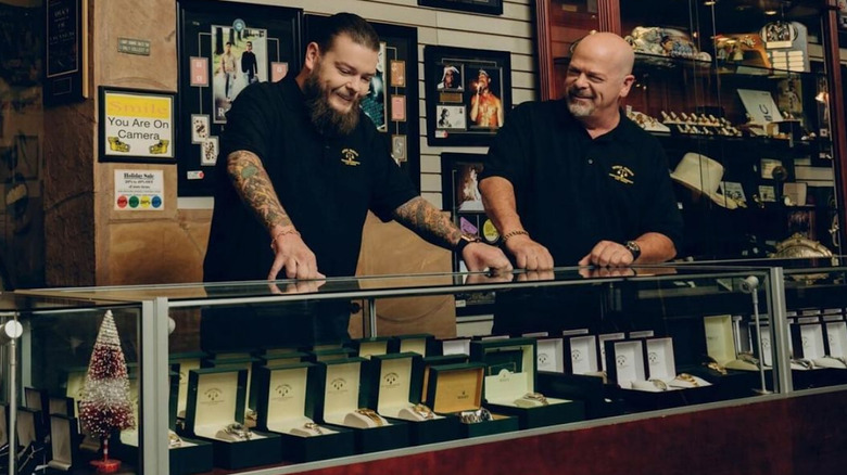 Corey Harrison and Rick Harrison behind pawn shop counter