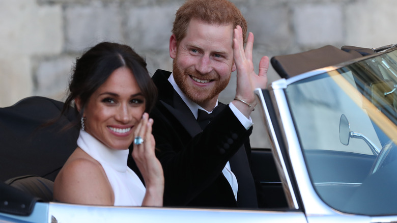 Prince Harry and Meghan Markle waving