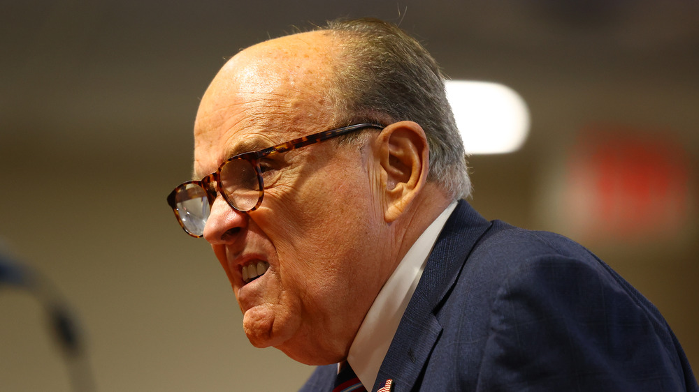 Rudy Giuliani squinting with his mouth open