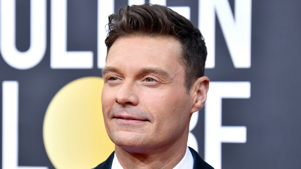 Ryan Seacrest looking off to the side at the Golden Globes