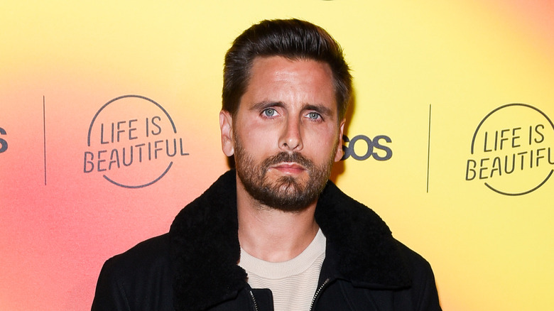 Scott Disick posing for photos