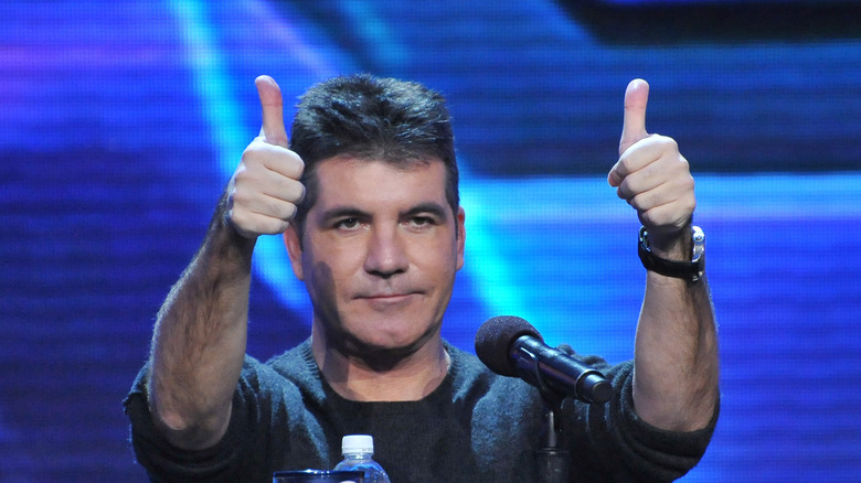 Simon Cowell giving two thumbs up