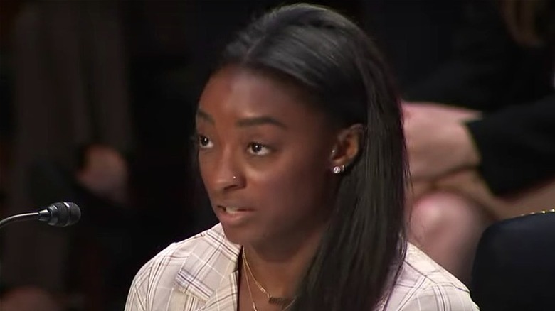 Simone Biles testifying against the FBI regarding the Nassar case