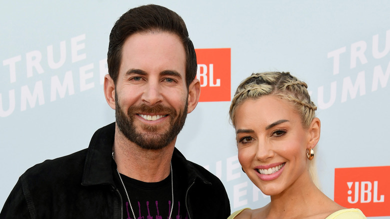 Tarek El Moussa and Heather Rae Young walk the red carpet at the JBL True Summer event.