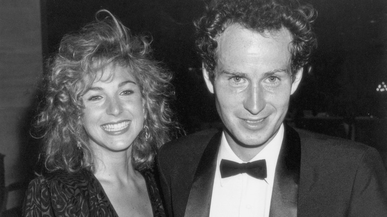 Tatum O'Neal and John McEnroe smiling in 1985