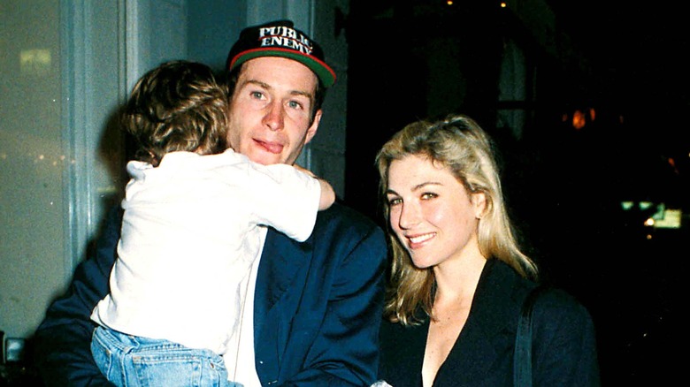 Tatum O'Neal and John McEnroe walking with their son in the 1990s