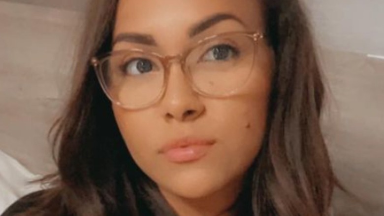 Briana DeJesus wearing glasses