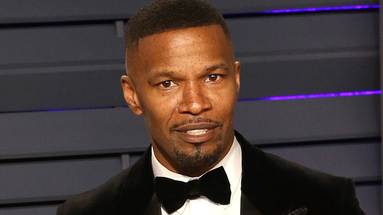 Jamie Foxx posing in a tuxedo