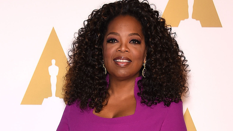 Oprah Winfrey in a purple dress 