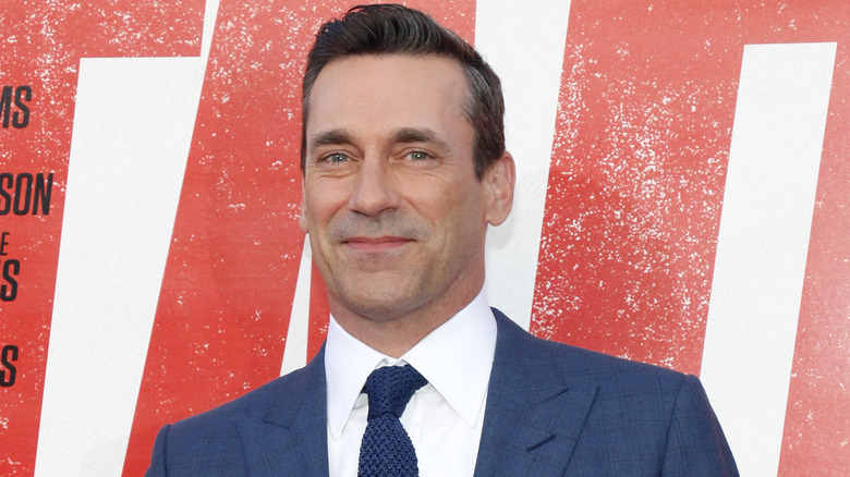 Jon Hamm smiles in a blue suit