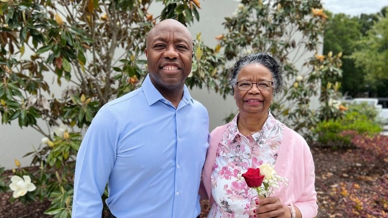 Tim Scott posing with his mother