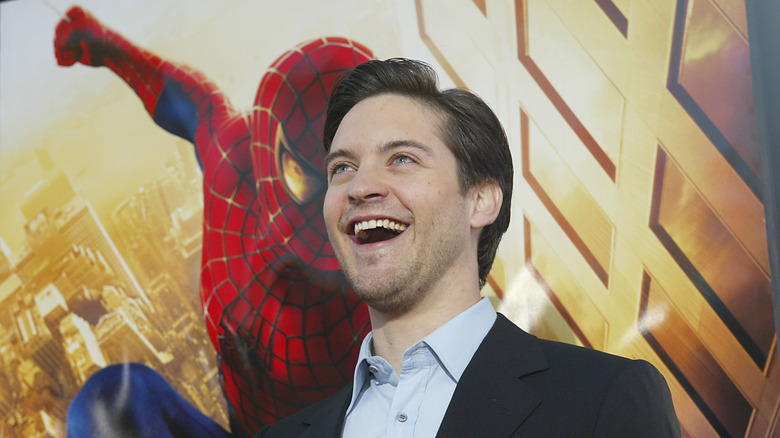 Tobey Maguire in front of Spider-Man poster