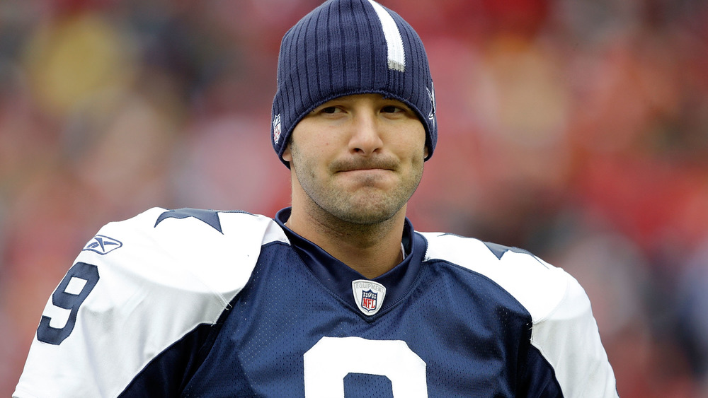 Tony Romo playing on the field before he retired in 2017