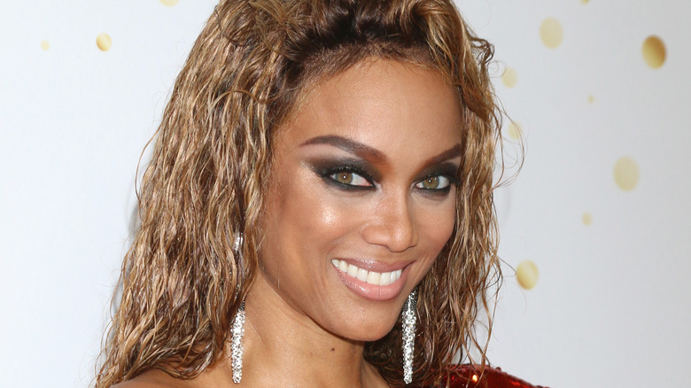 Tyra Banks smiles