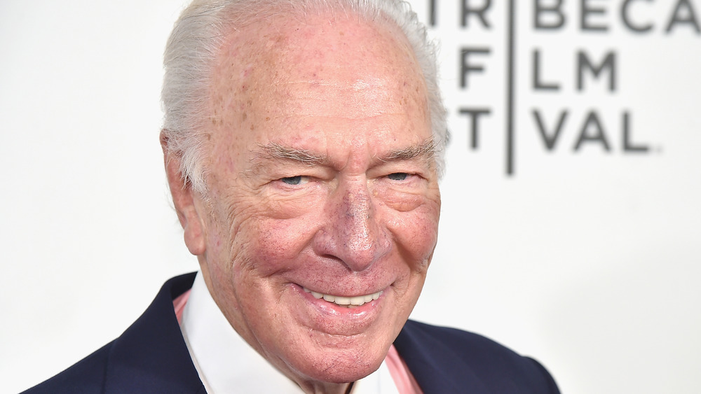 Christopher Plummer smiles at the camera on the Tribeca Film Festival red carpet