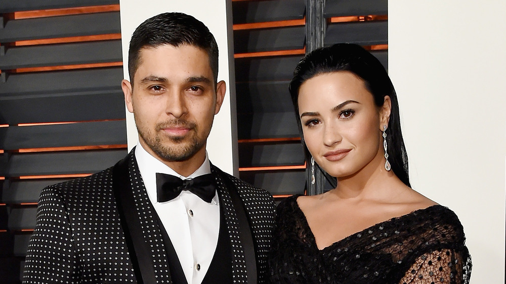 Demi Lovato and Wilmer Valderrama on a red carpet 