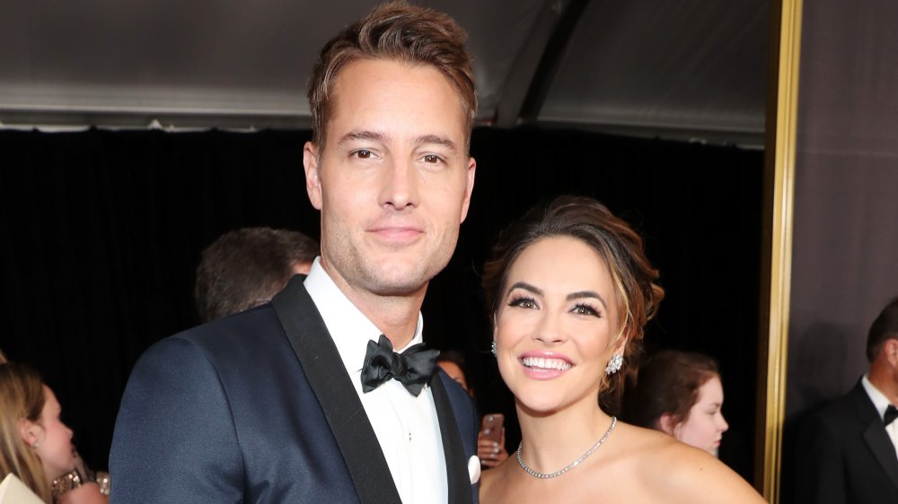 Justin Hartley, Chrishell Stause posing at an event
