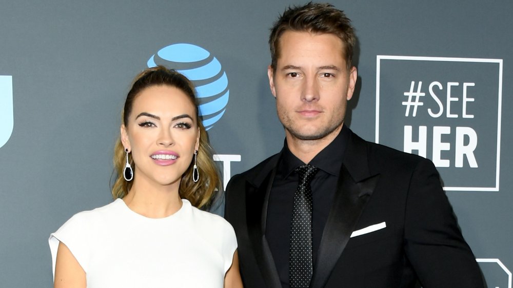 Chrishell Stause, Justin Hartley posing on the red carpet
