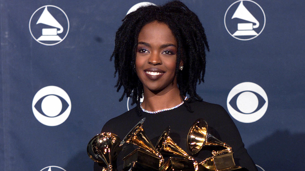 Lauryn Hill holding multiple awards backstage at the 41st Grammy Awards 