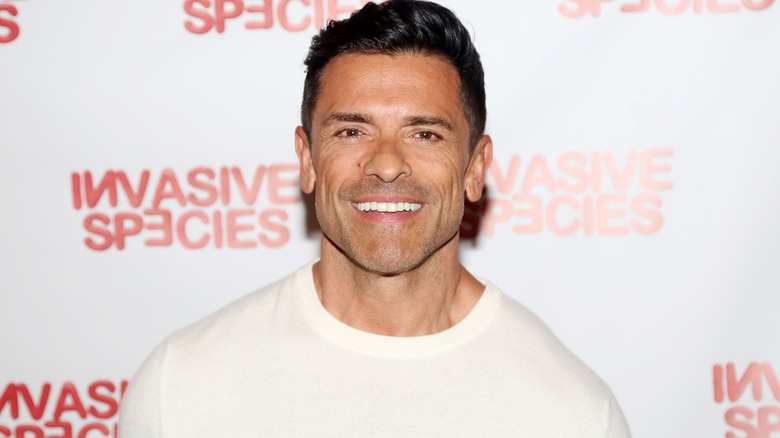 Mark Consuelos wearing a white sweater