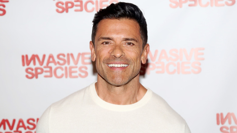 Mark Consuelos wearing a white sweater