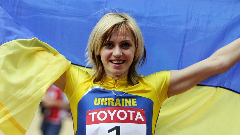 Lyudmila Blonska posing with the Ukrainian flag