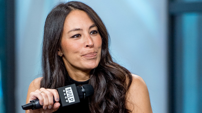 Joanna Gaines holding microphone