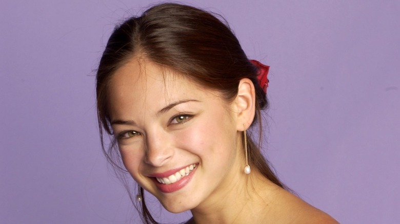 Kristin Kreuk smiling for a photoshoot