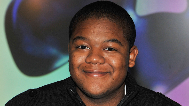 Kyle Massey smiling at a press event