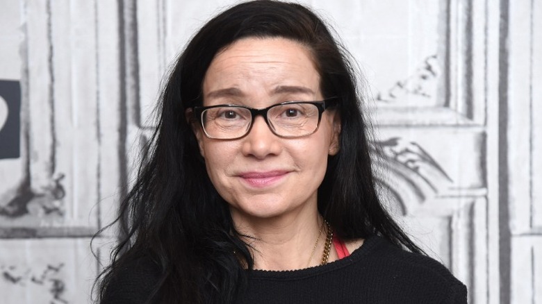 Janeane Garofalo with a closed-mouth smile