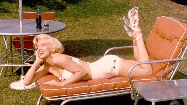 Marilyn Monroe lounging on beach chair