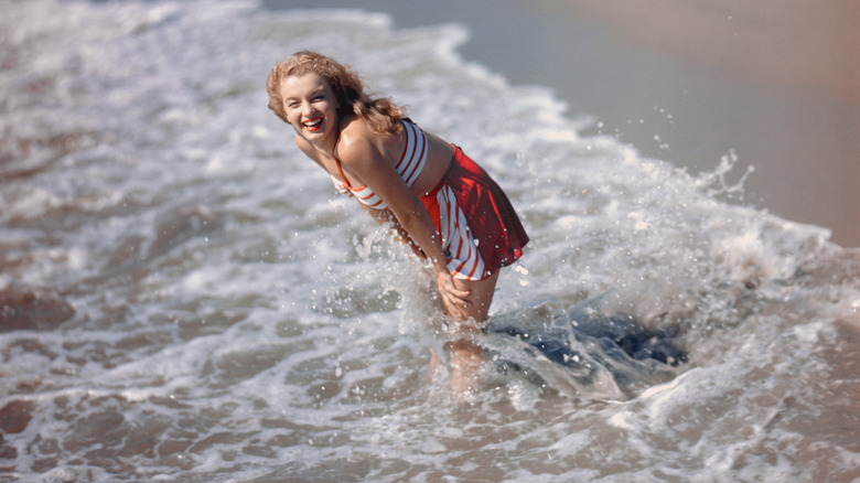 Marilyn Monroe playing in water