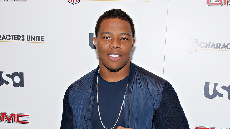 Ray Rice poses at an NFL event