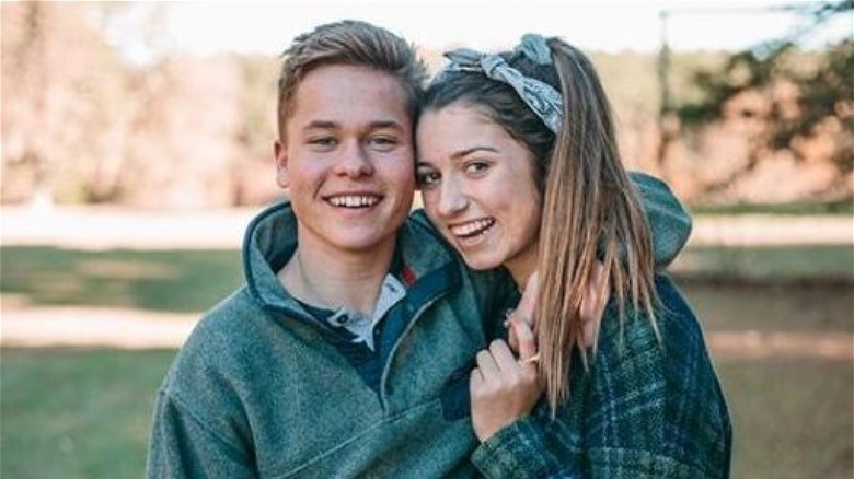 Lev Bure with his arm around Bella Robertson