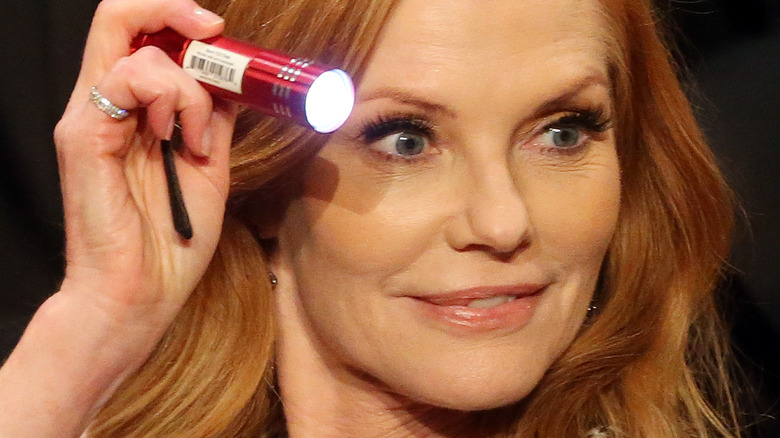 Marg Helgenberger with flashlight