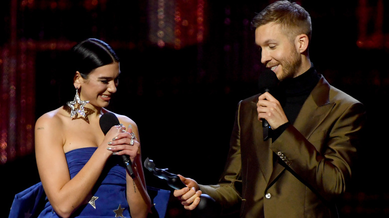 Dua Lipa and Calvin Harris accepting award