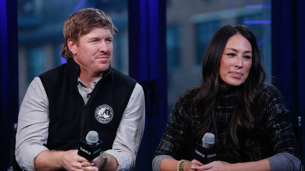 Chip and Joanna Gaines with microphones