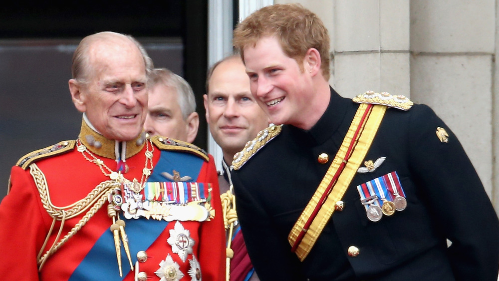 Prince Philip an Prince Harry wearing military uniforms