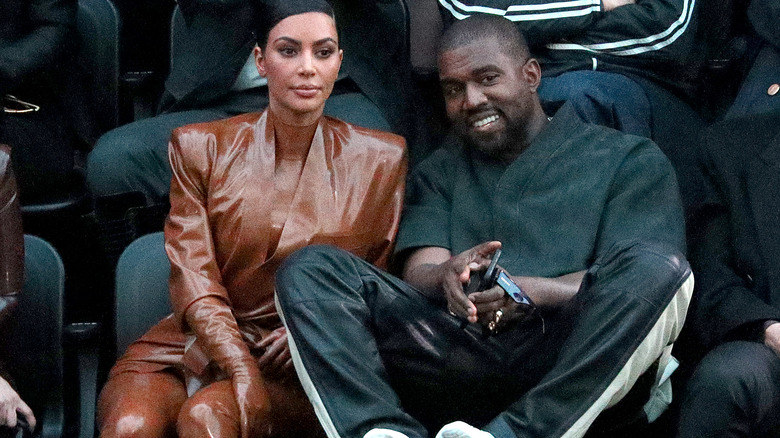 Kim Kardashian looking pensive with Kanye West