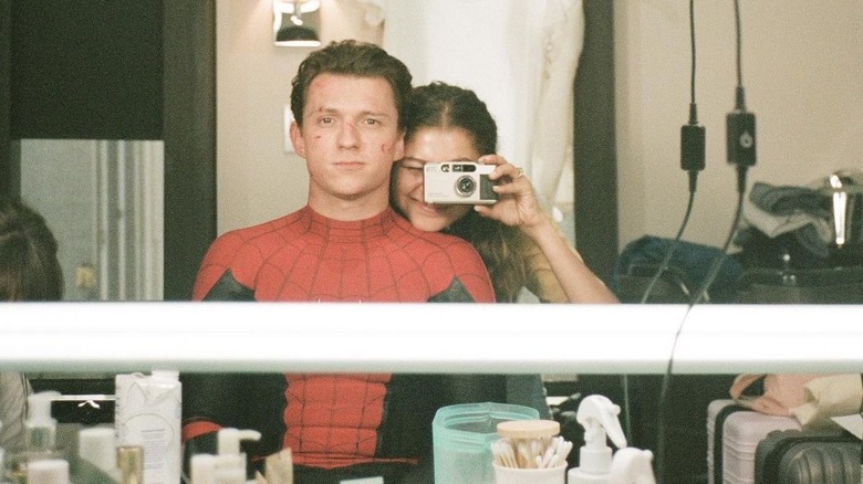 Zendaya taking mirror selfie with Tom Holland