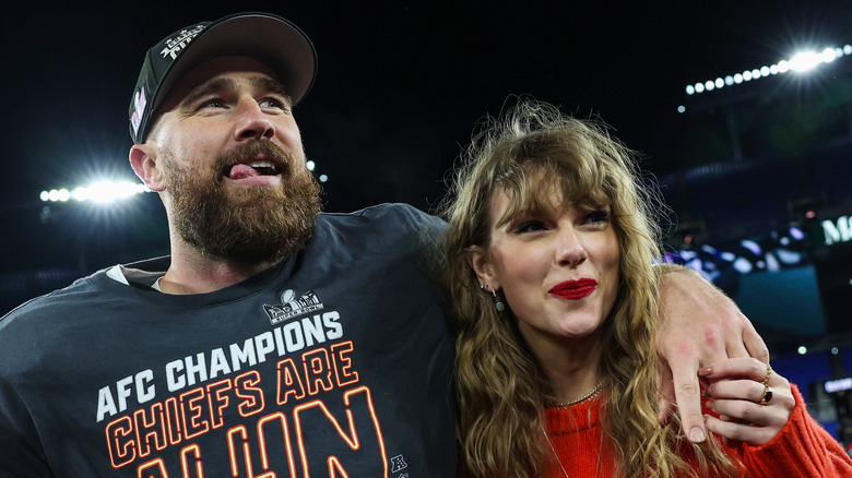 Travis Kelce and Taylor Swift smiling