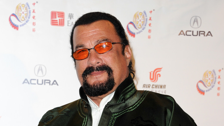 Steven Seagal wearing tinted sunglasses