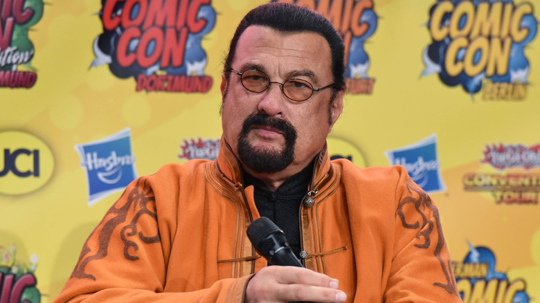 Steven Seagal sitting