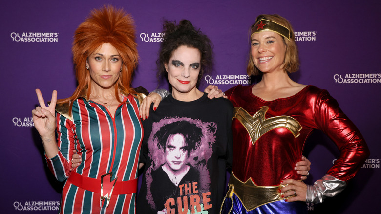 Nikki DeLoach, Kimberly Williams-Paisley, and Ashley Williams wearing costumes at Alzheimer's Association charity event