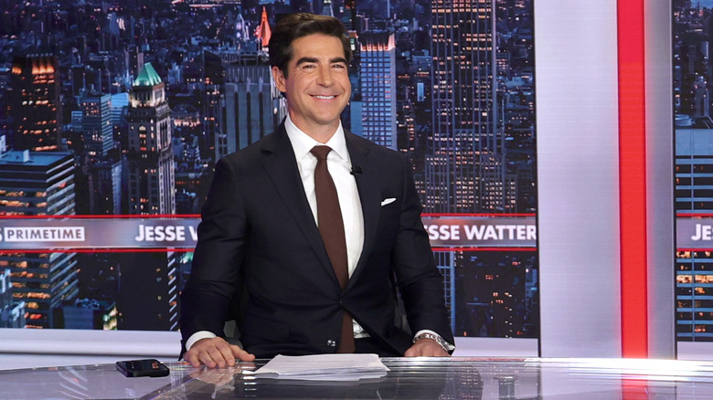 Jesse Watters grinning on the set of 