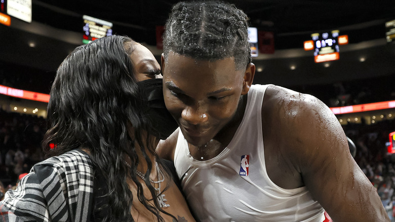 Anthony Edwards and Shannon Jackson all smiles after an NBA game