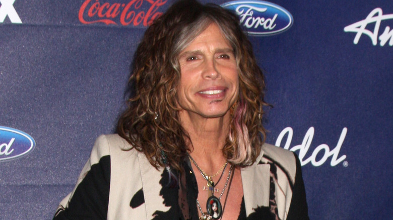 Steven Tyler smiling on the red carpet